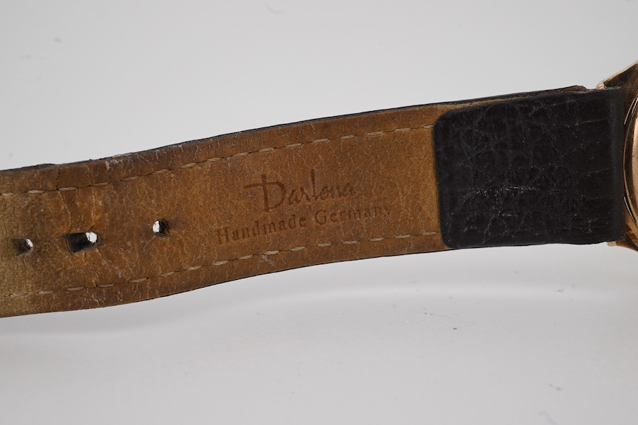 A gentleman's 9ct gold Accurist manual wind wrist watch, with dot and quarterly Arabic numerals, case diameter 33mm, on an associated leather strap. Condition - poor